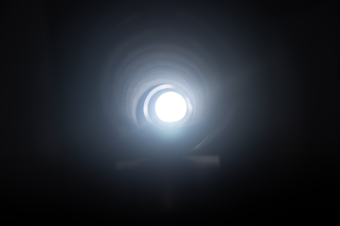 photo depicting abstract sadness - light at the end of a dark tunnel