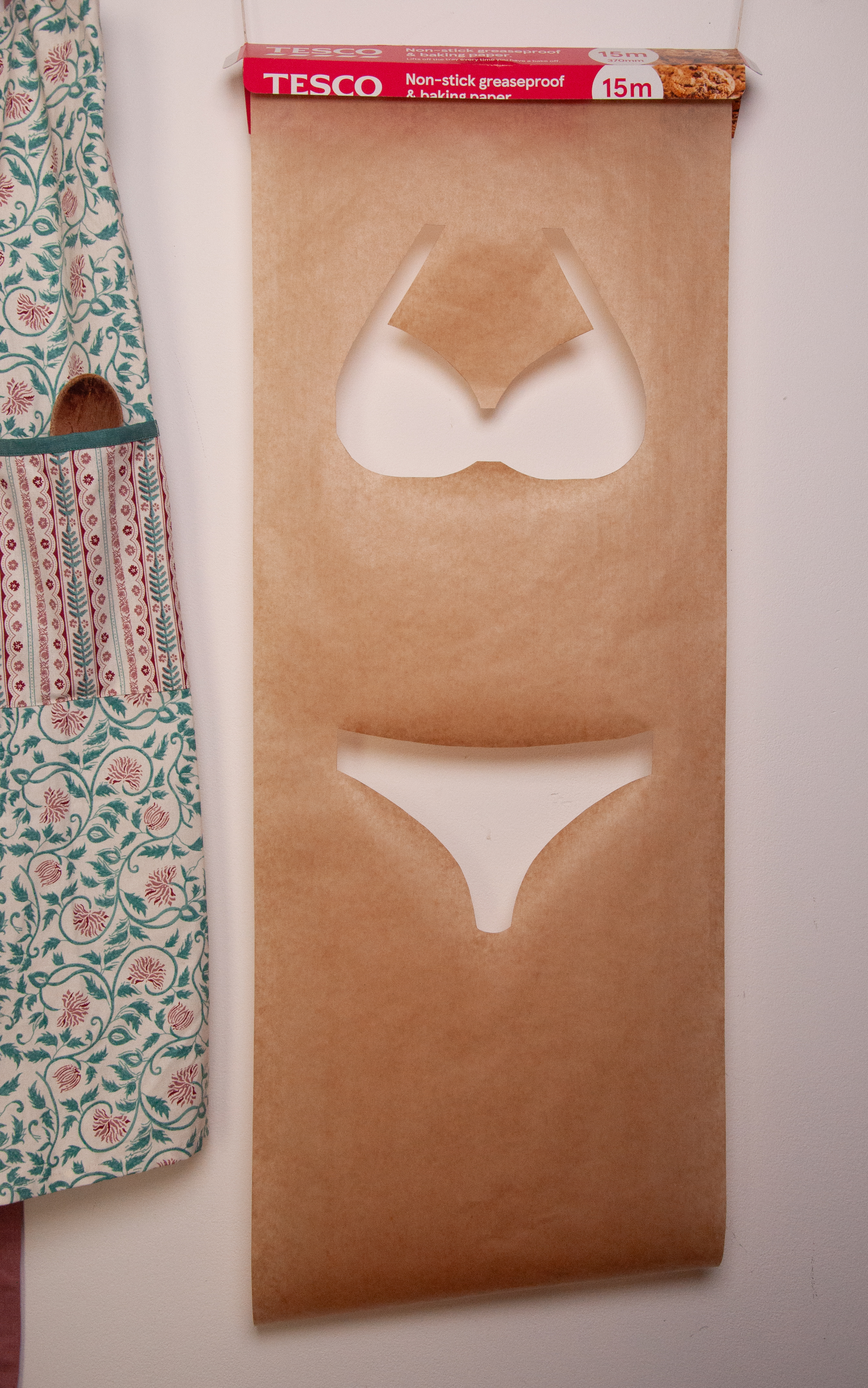 photograph of a bikini cut out of baking paper